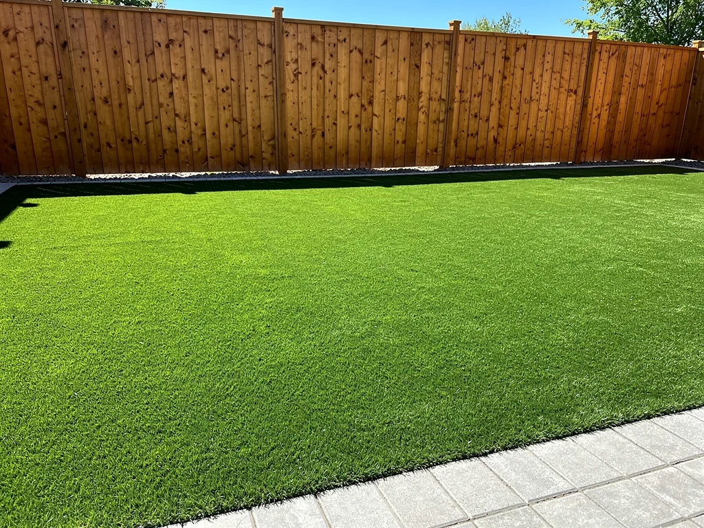 Beautifully finished artificial turf backyard installation in Windsor Ontario